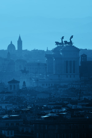 Rome rooftop view at sunset with ancient architecture in Italy in blue tone.の写真素材