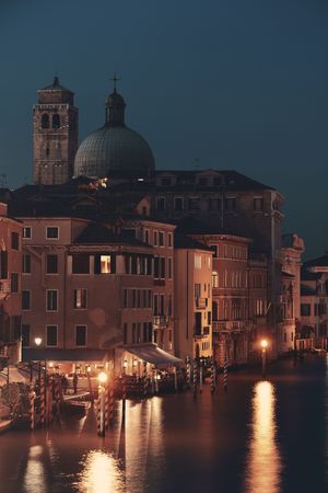 Venice canal view at night with historical buildings. Italy.の写真素材