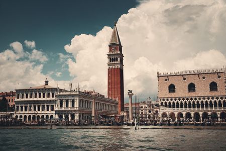 Waterfront view of Bell Tower and historical buildings at Piazza San Marco in Venice, Italy.の写真素材