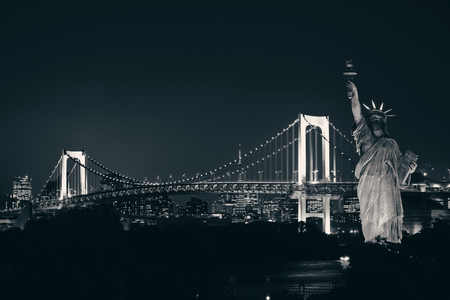 Tokyo bay with rainbow bridge and Statue of Liberty in Japan.の写真素材