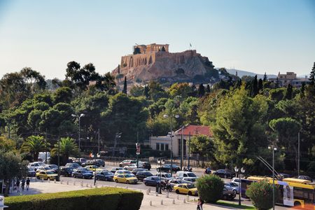 ATHENS - SEP 26: Street view with Acropolis on September 26, 2016 in Athens, Greece. Athens is one of the worlds oldest cities with the history of 3400 years.のeditorial素材