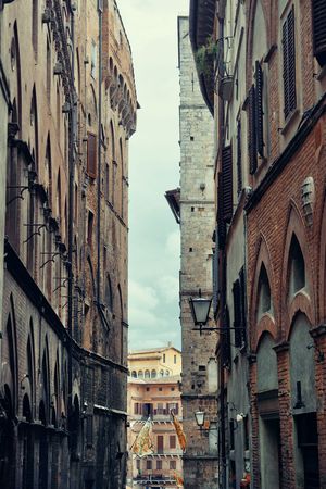 Street view with old buildings in Siena, Italy.の写真素材