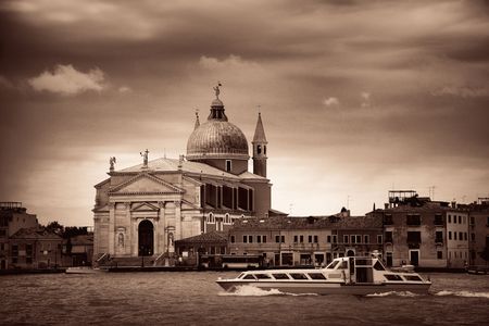 City skyline of Venice with church and historical buildings viewed from waterfront in Italy.の写真素材