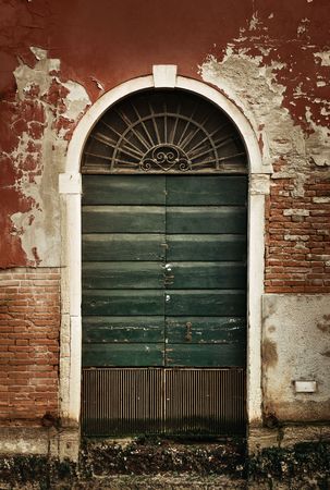 Vintage door and window in old buildings in Venice, Italy.の写真素材