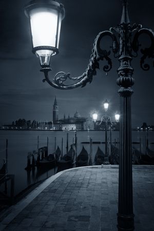 Venice at night with street lamp and San Giorgio Maggiore church in Italy.の写真素材