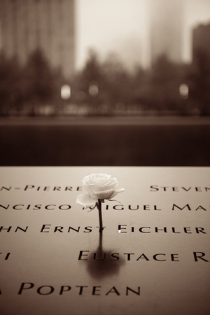 NEW YORK CITY - NOV 12: September 11 memorial in a foggy day on November 12, 2014 in Manhattan, New York City. With population of 8.4M, it is the most populous city in the United States.のeditorial素材