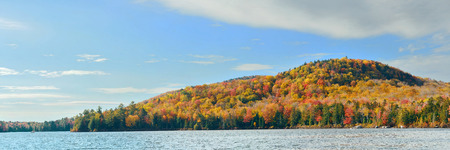 Lake with Autumn foliage and mountains in New England Stoweの写真素材