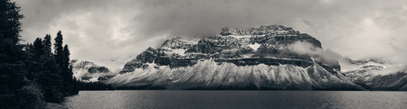 Bow Lake panorama with snow capped mountain and forest in Banff National Parkの写真素材