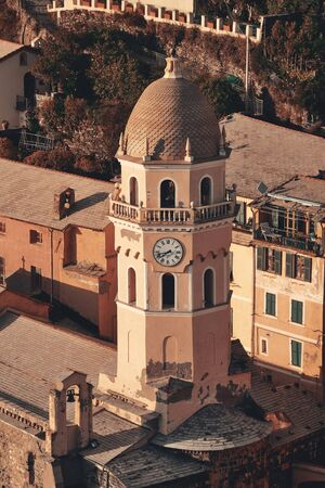 Landmark church bell tower and buildings in Vernazza, one of the five villages in Cinque Terre, Italy.の写真素材