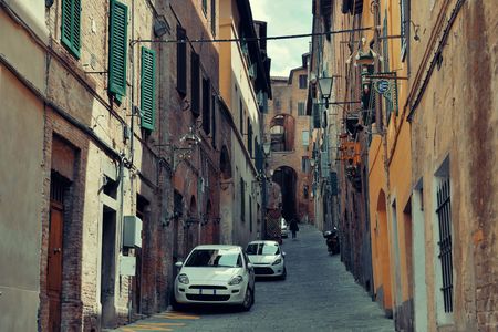 Street view with old buildings in Siena, Italy.のeditorial素材
