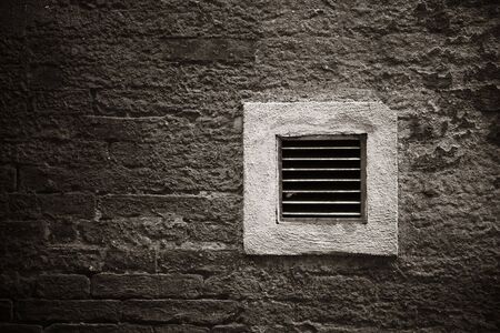 Italy Siena old building windows and brick wallの写真素材