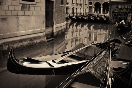 Gondola park in water in Venice canal with historical buildings. Italy.の写真素材