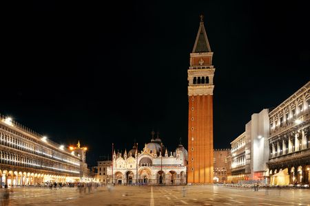 Bell tower and historical buildings at night at Piazza San Marco in Venice, Italy.の写真素材