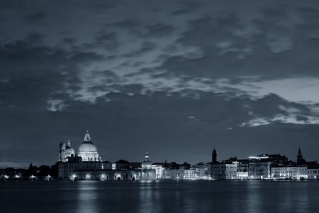 Venice skyline at night with Santa Maria della Salute church in Italy.の写真素材