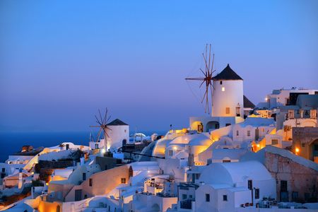 Santorini skyline blue hour with buildings and windmill in Greece.の写真素材