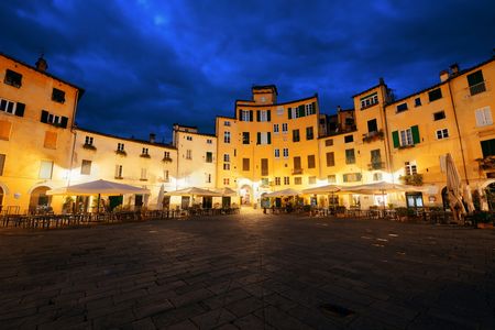 Piazza dell Anfiteatro in Lucca Italy night viewの写真素材