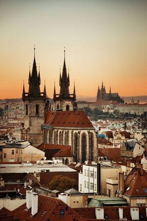 Church of Our Lady before TÃ½n and Prague skyline rooftop view at sunset in in Czech Republicの写真素材