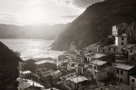 Vernazza with buildings on rocks over sea black and white in Cinque Terre, Italy.の写真素材