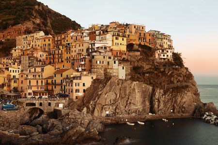Manarola overlook Mediterranean Sea with buildings over cliff in Cinque Terre, Italy.の写真素材