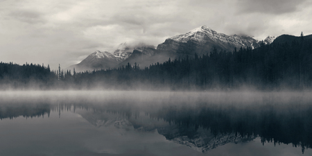Lake Herbert panorama in a foggy morning with glaciers mountain and reflection in Banff National Park, Canadaの写真素材