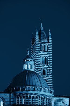 Siena Cathedral closeup as the famous landmark in medieval town at night in Italy.の写真素材