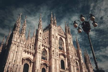 Duomo and lamp post at Cathedral Square or Piazza del Duomo in Italian, the center of Milan city in Italy.の写真素材