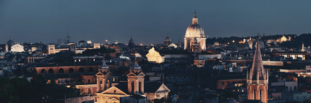 Rome rooftop view with skyline and ancient architecture in Italy at night.の写真素材
