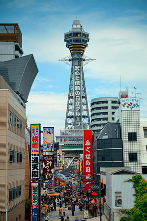 OSAKA, JAPAN - MAY 11: Tsutenkaku with street as famous landmark on May 11, 2013 in Osaka. With nearly 19 million inhabitants, Osaka is the second largest metropolitan area in Japan after Tokyo.