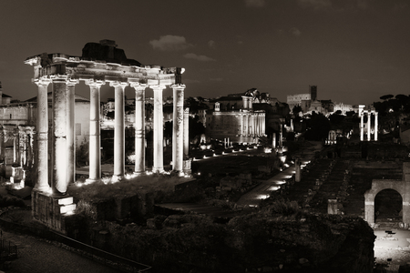 Rome Forum with ruins of ancient architecture at night. Italy.の写真素材