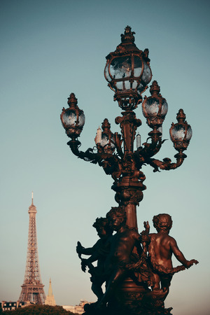 Vintage lamp post on Alexandre III bridge in Paris, France.の写真素材
