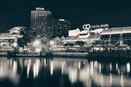 SINGAPORE - APR 5: Clarke Quay at night with street view and restaurant on April 5, 2013 in Singapore. As a historical riverside quay, it is now the hub of Singaporean nightclubs.のeditorial素材