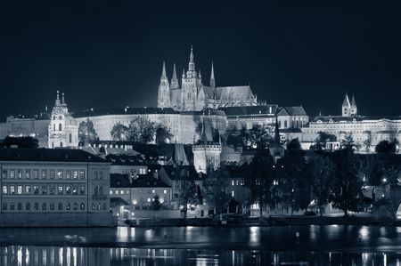 Prague skyline and bridge over river in Czech Republic at night.の写真素材