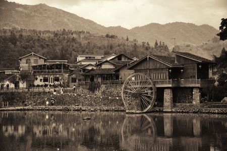 FUJIAN, CHINA â MARCH 2, 2018: Yunshuiyao old town by the river with watermill in Fujian, China.のeditorial素材