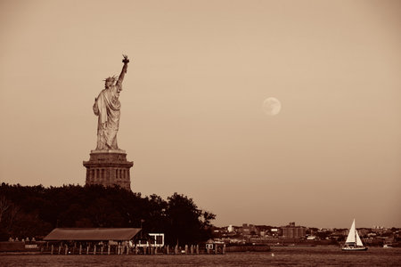 Statue of Liberty and full moon in BW in New York Cityの写真素材