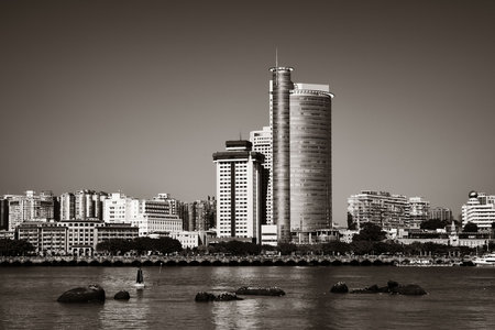 Urban buildings at waterfront in Xiamen, Fujian, China.の写真素材