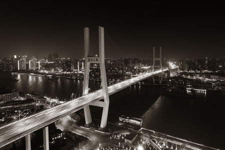 Shanghai Nanpu Bridge over Huangpu River with busy traffic in China.の写真素材