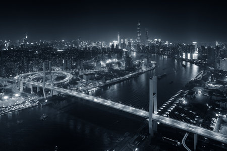 Shanghai Nanpu Bridge over Huangpu River with busy traffic in China.の写真素材