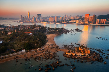 Xiamen skyline aerial view at sunset with urban buildings in Fujian, China.の写真素材
