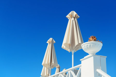 Leisure life settings with umberlla in Santorini, Greece.の写真素材
