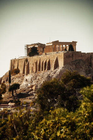 Historical ruins of temples in Acropolis on mountain top in Athens, Greece.の写真素材