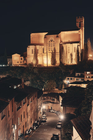 Basilica of San Domenico in old medieval town Siena at night in Italyの写真素材