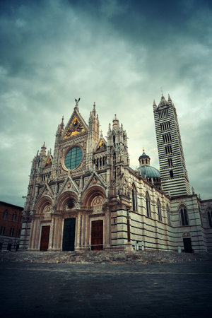 Siena Cathedral closeup as the famous landmark in medieval town in an overcast day in Italy.の写真素材