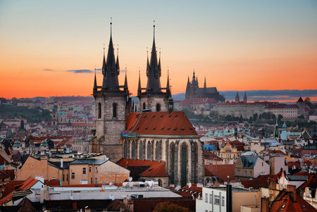 Church of Our Lady before TÃ½n and Prague skyline rooftop view at sunset in in Czech Republicの写真素材