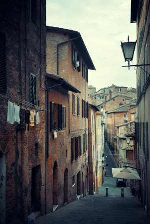 Street view with old buildings in Siena, Italy.の写真素材