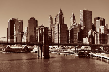 Manhattan financial district with skyscrapers and Brooklyn Bridge.の写真素材
