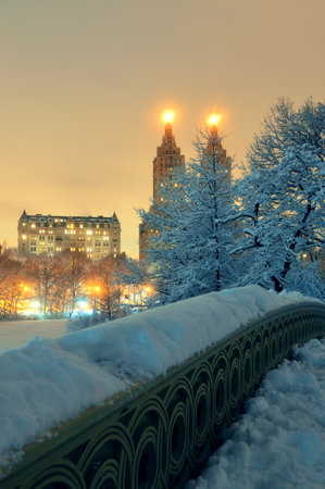 Central Park winter with skyscrapers and Bow Bridge in midtown Manhattan New York Cityの写真素材
