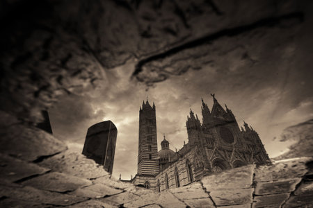Siena Cathedral reflection after rain as the famous landmark in medieval town in Italy.の写真素材