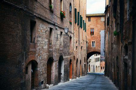 Street view with old buildings in Siena, Italy.の写真素材