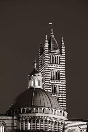 Siena Cathedral closeup as the famous landmark in medieval town at night in Italy.の写真素材