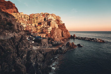Manarola overlook Mediterranean Sea with buildings over cliff in Cinque Terre, Italy.の写真素材